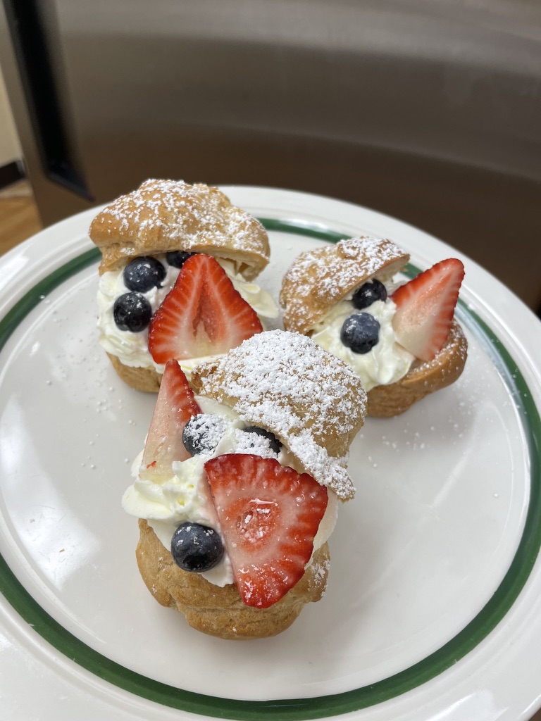 Cream puffs filled with whipped cream and fresh berries